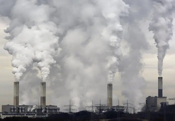 Industrial emissions rising into the atmosphere