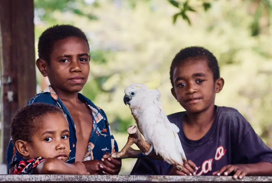 Children with a cockatoo